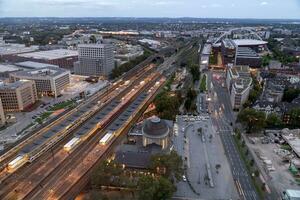 evening aerial view of Cologne station Koln Messe Deutz and illuminated railway tracks, seen from the Cologne Triangle photo