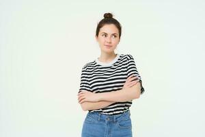 Portrait of young stylish woman, 25 years old, looking upbeat and motivated, posing for photo against white background