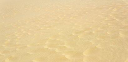 natural background, sandy desert surface with dunes photo