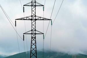 power line pylon in mountainous area photo