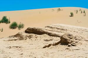 desert landscape, layered deposits in the sandy desert photo