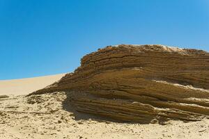 desert landscape, layered sandstone rock photo