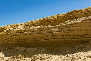 desert landscape, layered sandstone rock photo