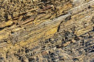 background, texture of layered brown rock photo