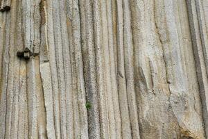 natural background, the surface of the rock, consisting of vertical basalt columns photo
