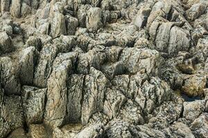 natural stone background, the remains of lava basalt columns form a kind of steps photo
