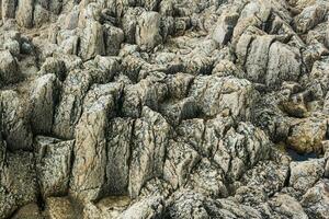 natural Roca fondo, el permanece de lava basalto columnas formar un tipo de pasos foto