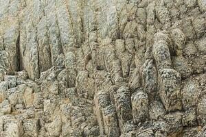 natural stone background, the remains of lava basalt columns form a kind of steps photo