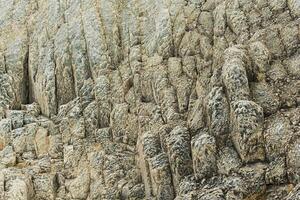 natural Roca fondo, el permanece de lava basalto columnas formar un tipo de pasos foto