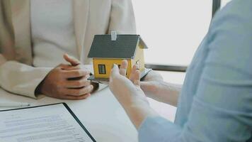 Real estate agents and new homeowners sign home sales or lease agreements. Ready to sign a home or office loan agreement video