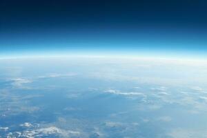 ai generado aéreo ver a el azul la tierra superficie con atmosférico calina y nubes foto