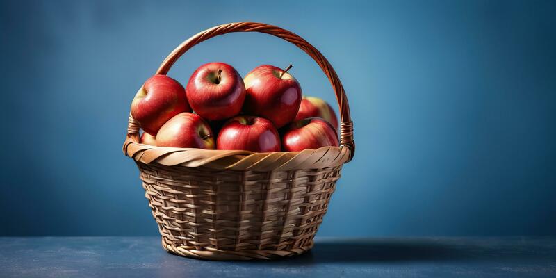 AI generated a basket full of red apples on a blue background