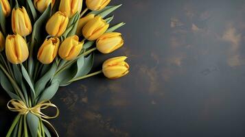 ai generado en un oscuro gris hormigón fondo, allí es un ramo de flores de En Vivo amarillo tulipanes atado con un amarillo cinta, el Derecha es izquierda blanco espacio para el texto foto