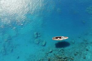 AI generated Aerial drone top down photo of beautiful red wooden traditional fishing boat anchored in crystal clear sea