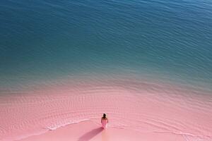 AI generated Aerial view of the woman in Pink beach and blue sea photo
