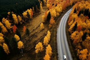 AI generated Arial view of heavy truck on a narrow twisting road. Autumn colorful trees by the sides of the road. photo