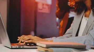 Careful businesswoman analyzing financial graphs report on computer, typing company strategy Executive manager working overhours at investment plan in startup office. Business concept video