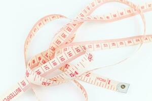 Measuring tape isolated on white background. Clipping path included. photo