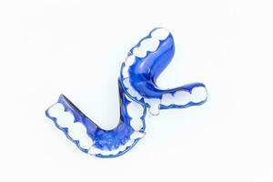 Invisible dental aligners on white background. Orthodontics photo