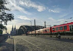 Train and Hohenzollern bridge Cologne photo