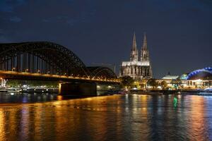 Cologne Cathedral and Hohenzollern Bridge in the evening photo