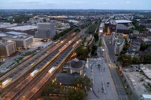 evening aerial view of Cologne station Koln Messe Deutz and illuminated railway tracks, seen from the Cologne Triangle photo