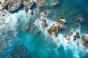 ai generado aéreo ver de camino, rocoso mar costa con olas y piedras a puesta de sol paisaje con hermosa camino, transparente azul agua, rocas parte superior ver desde zumbido de autopista en verano foto