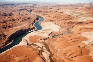 AI generated aerial birds eye view of a large and tall mountains and a big blue bendy river flowing through the mountains photo