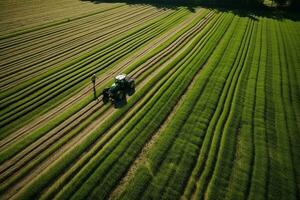 ai generado tomando cuidado de el cultivo. aéreo ver de un tractor fertilizante un cultivado agrícola campo. foto
