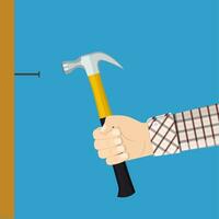 Man holding hammers a nail into a wall vector