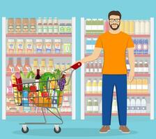 Young man pushing supermarket shopping cart full of groceries. Vector illustration in flat style