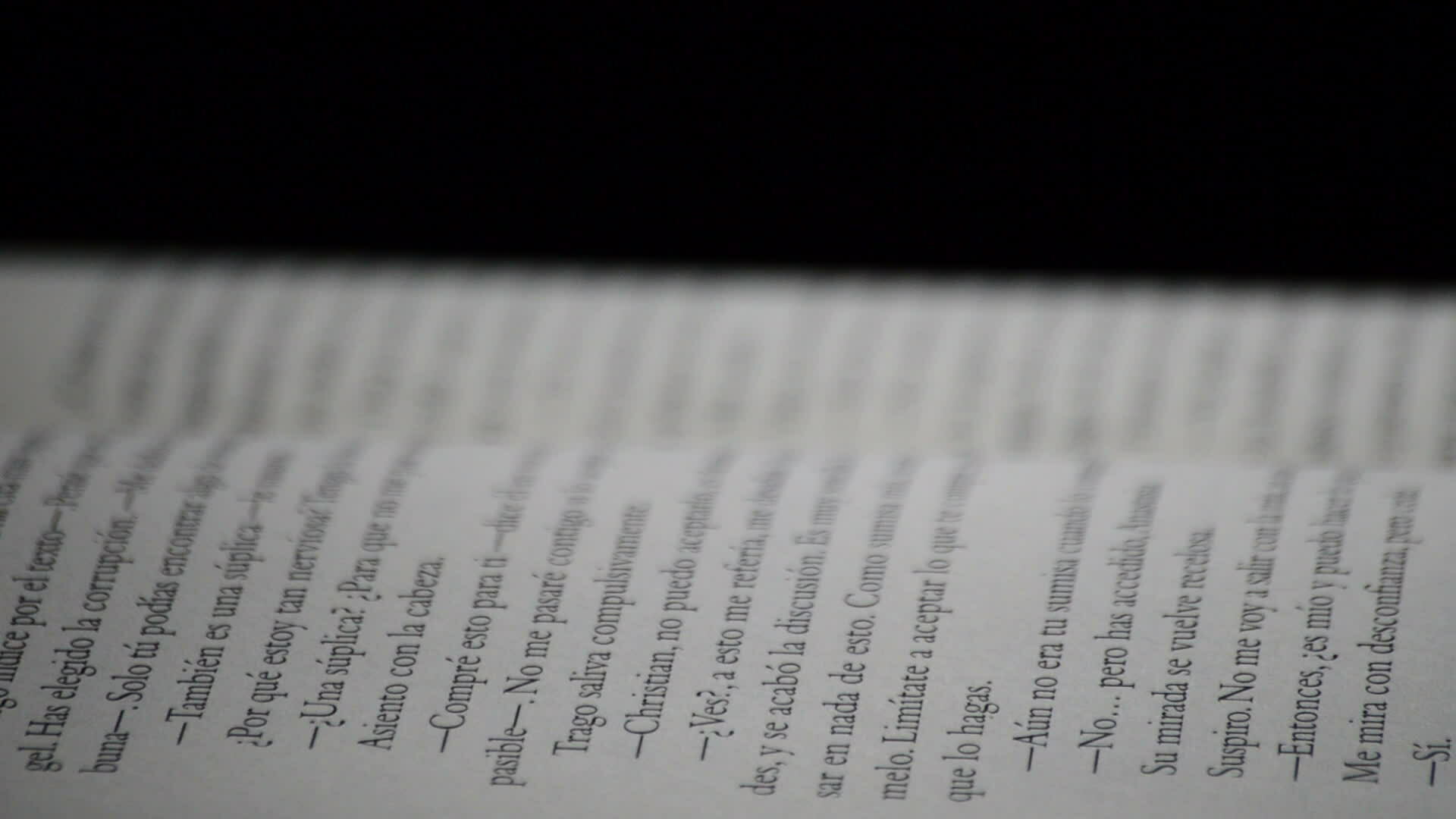 Words and texts of a open book written in spanish rotating 35884262