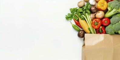 ai generado sano comida en papel bolso vegetales y frutas en blanco antecedentes. ai generado foto