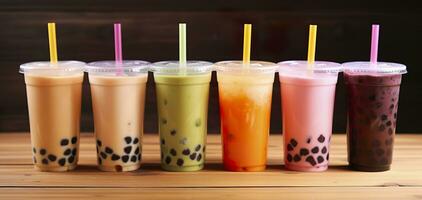 AI generated Plastic cups of different tasty bubble tea on wooden background. Generative AI photo