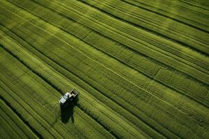 AI generated Taking care of the Crop. Aerial view of a Tractor fertilizing a cultivated agricultural field. photo