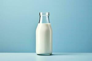 AI generated A glass bottle with full milk on blue background. AI Generated photo