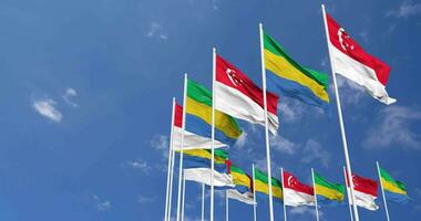 Gabon and Singapore Flags Waving Together in the Sky, Seamless Loop in Wind, Space on Left Side for Design or Information, 3D Rendering video