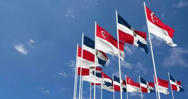 Dominican Republic and Singapore Flags Waving Together in the Sky, Seamless Loop in Wind, Space on Left Side for Design or Information, 3D Rendering video