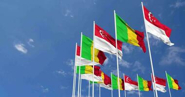 Mali and Singapore Flags Waving Together in the Sky, Seamless Loop in Wind, Space on Left Side for Design or Information, 3D Rendering video