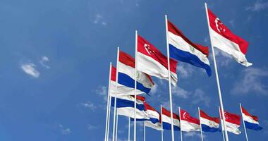 Paraguay and Singapore Flags Waving Together in the Sky, Seamless Loop in Wind, Space on Left Side for Design or Information, 3D Rendering video