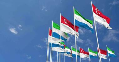 Sierra Leone and Singapore Flags Waving Together in the Sky, Seamless Loop in Wind, Space on Left Side for Design or Information, 3D Rendering video
