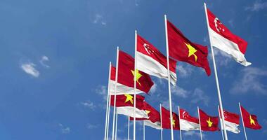 Vietnam y Singapur banderas ondulación juntos en el cielo, sin costura lazo en viento, espacio en izquierda lado para diseño o información, 3d representación video