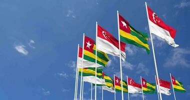 Togo and Singapore Flags Waving Together in the Sky, Seamless Loop in Wind, Space on Left Side for Design or Information, 3D Rendering video