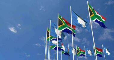 Antarctica and South Africa Flags Waving Together in the Sky, Seamless Loop in Wind, Space on Left Side for Design or Information, 3D Rendering video