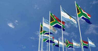 argentina y sur África banderas ondulación juntos en el cielo, sin costura lazo en viento, espacio en izquierda lado para diseño o información, 3d representación video