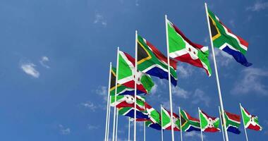 Burundi and South Africa Flags Waving Together in the Sky, Seamless Loop in Wind, Space on Left Side for Design or Information, 3D Rendering video