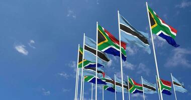 Botswana y sur África banderas ondulación juntos en el cielo, sin costura lazo en viento, espacio en izquierda lado para diseño o información, 3d representación video