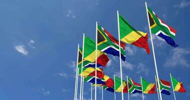 Congo e sul África bandeiras acenando juntos dentro a céu, desatado ciclo dentro vento, espaço em esquerda lado para Projeto ou Informação, 3d Renderização video