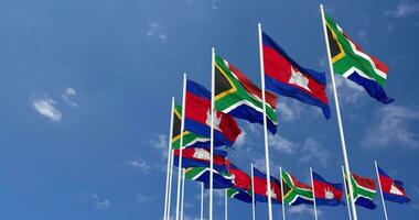 Camboya y sur África banderas ondulación juntos en el cielo, sin costura lazo en viento, espacio en izquierda lado para diseño o información, 3d representación video