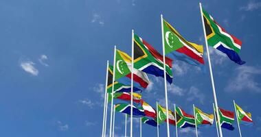 Comoros and South Africa Flags Waving Together in the Sky, Seamless Loop in Wind, Space on Left Side for Design or Information, 3D Rendering video